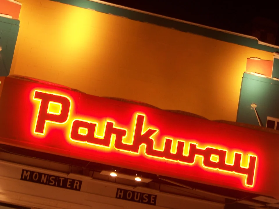 Glowing neon movie theater marquee on opening night